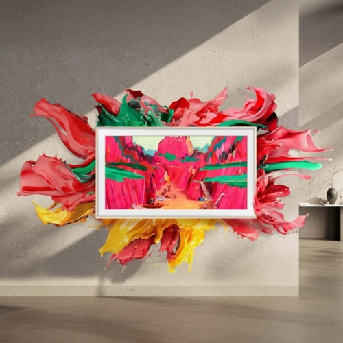 Samsung The Frame TV hung on a wall with colorful paint exploding from the screen onto the wall