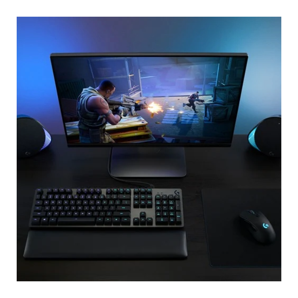 Gaming setup with monitor, keyboard, and mouse on a desk