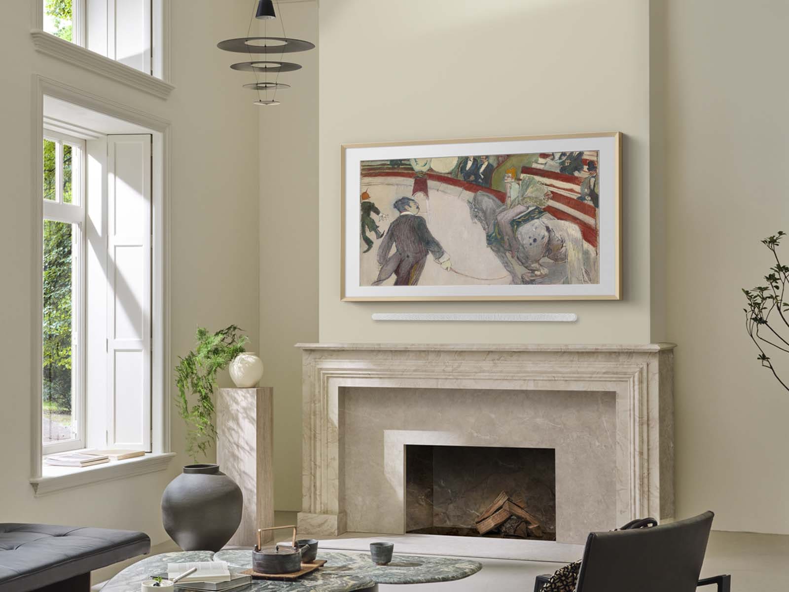 Living room with a fireplace and framed artwork on the wall